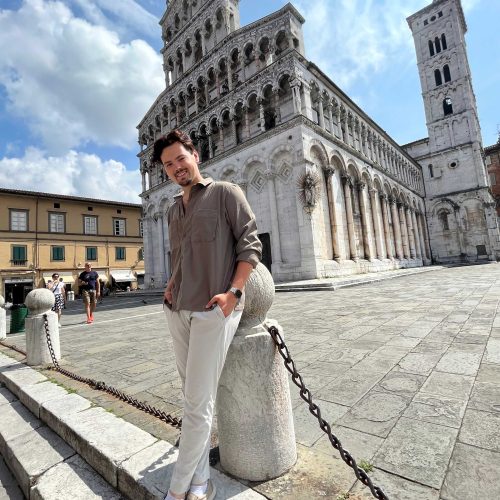 Man stnading out a historic building